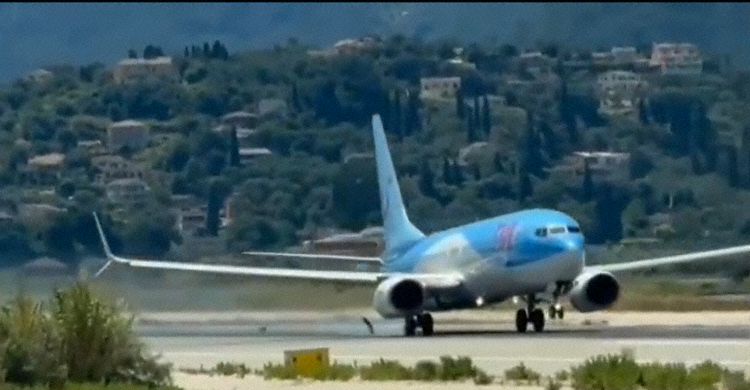 The aircraft seen after takeoff rotation, parts of the tyre separating