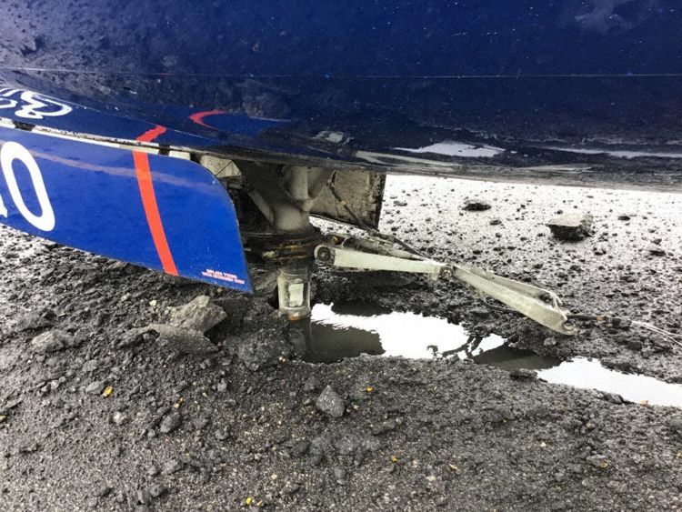 The rest of the nose gear strut buried in the runway surface (Photo: NAIB)