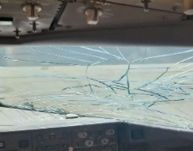 The cracked right hand windshield